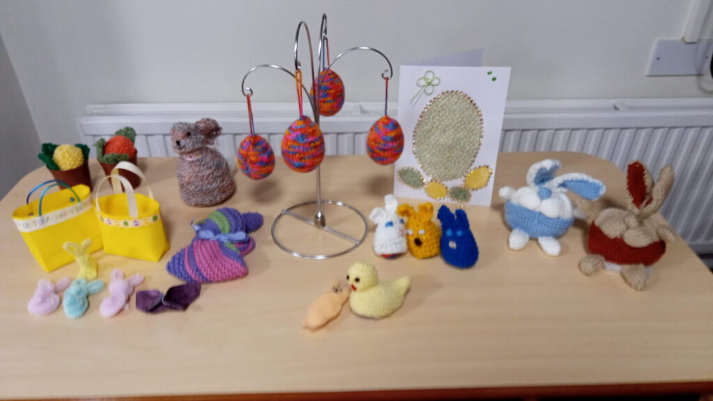 Busy Bees members brought in Easter items they'd made: knitted rabbits, ducks and eggs (in knitted egg-cups!), plus decorative cards and gift boxes. All in bright, Spring colours.
