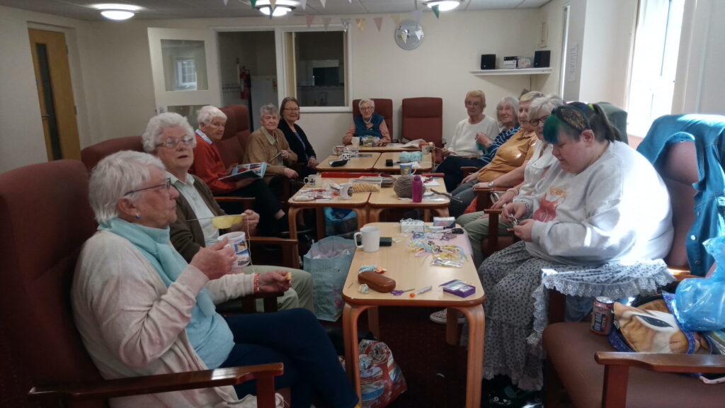 Eleven members of Busy Bees crafts group enjoy tea & biscuits during final session of year 2023/24